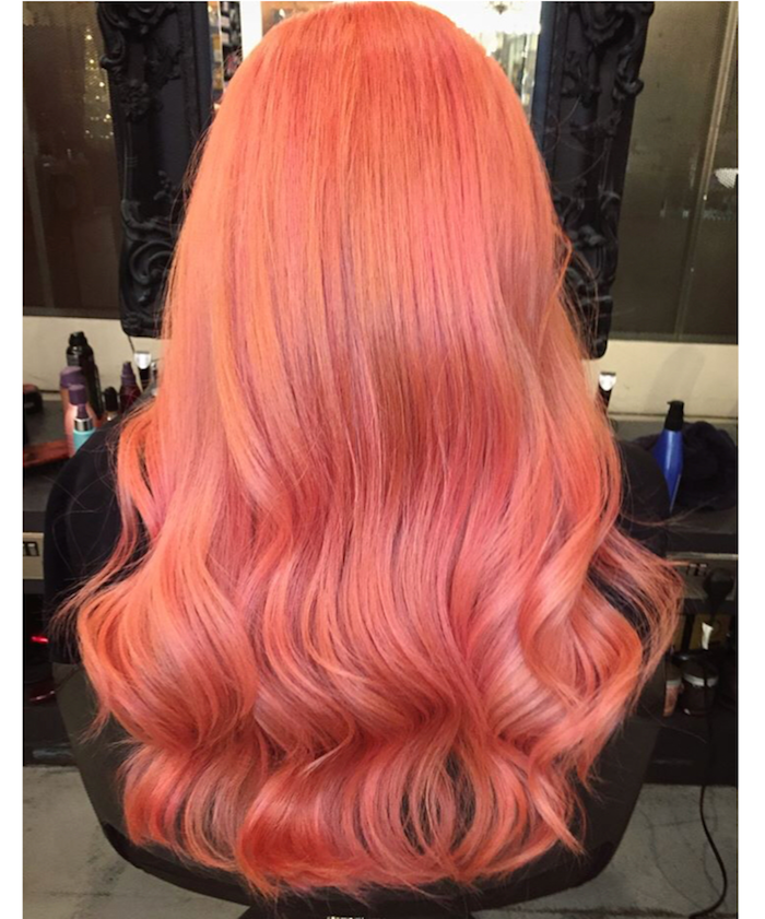 Deep reddish peach hair with waves in London salon