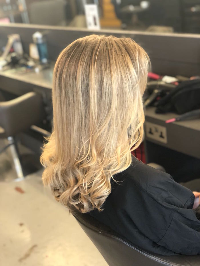 golden blonde highlights with a blow dry in the Live True London Brixton salon