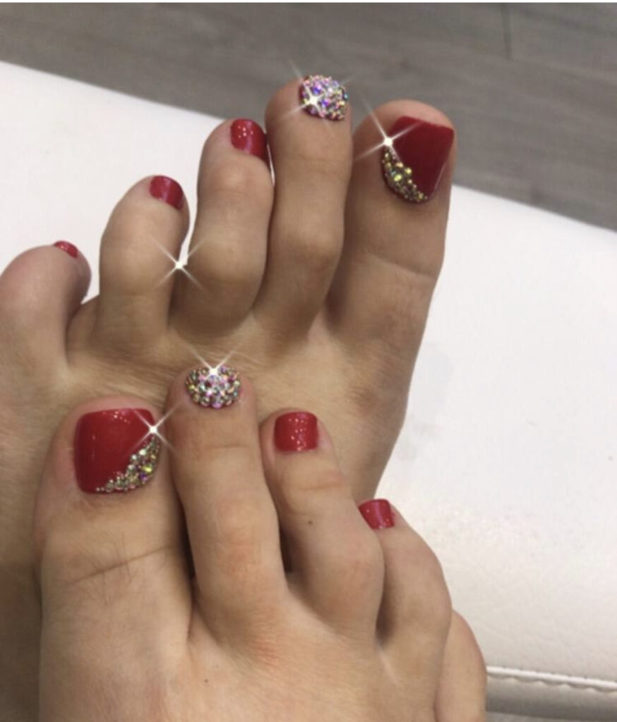 regular pedicure in vauxhall nine elms london with red nail polish and sparkles